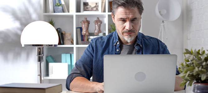 Senior man on computer