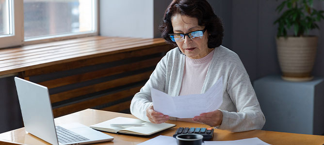 Senior woman looking at document