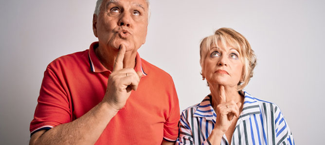 Senior couple thinking of questions