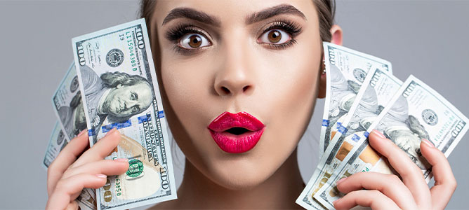 Woman holding lots of cash