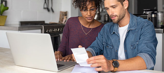 Young couple reviewing documents