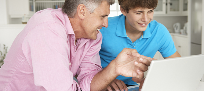 Father and son on computer