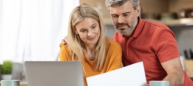 Mature couple reading paperwork