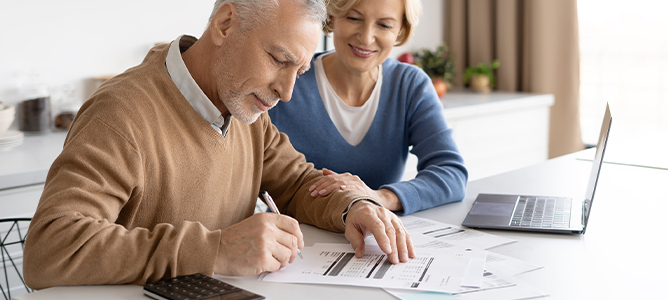 Senior couple reviewing budget
