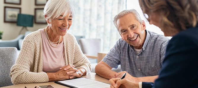 Senior couple consulting with a financial professional