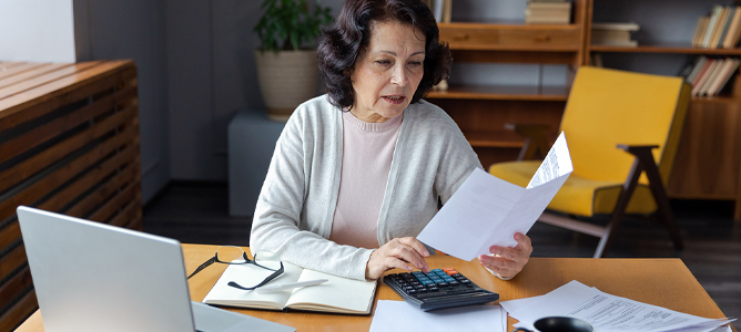 Mature woman updating paperwork