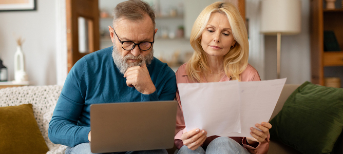 Mature couple doing paperwork
