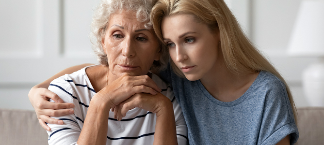 Worried daughter caring for senior mother