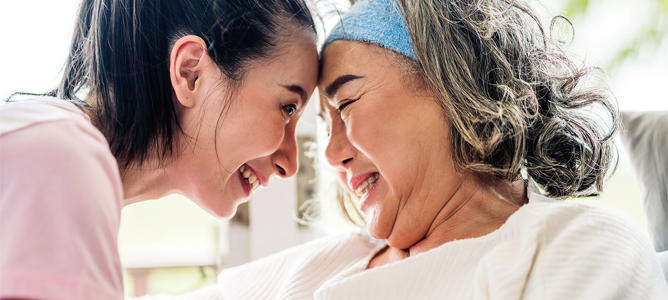 Female caregiver with senior mother