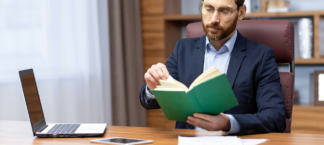 Middle-aged man reading a book