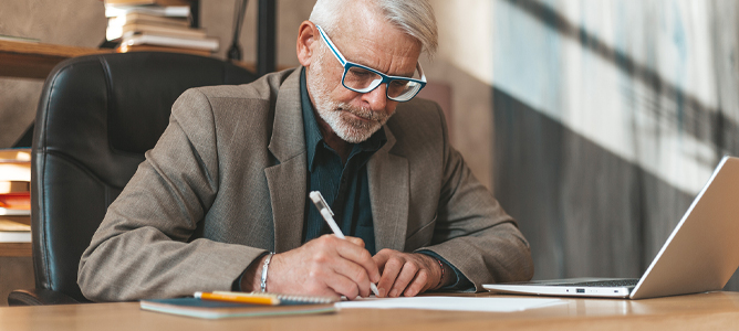 Mature man writing letter of last instructions