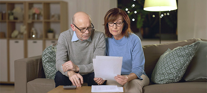 Senior couple reviewing documents