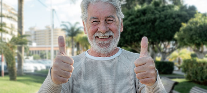 Senior man thumbs up