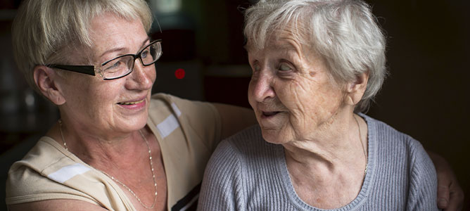 Female caregiver with senior mother