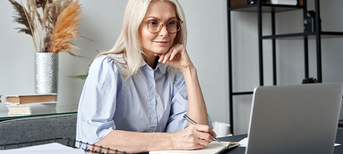 Senior woman looking at computer